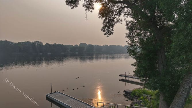 Hazy sunrise over Champlin, Minnesota on July 16.