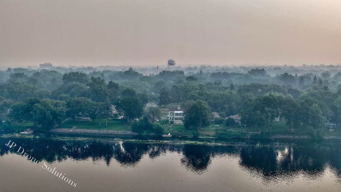 Hazy sunrise over Champlin, Minnesota on July 16.
