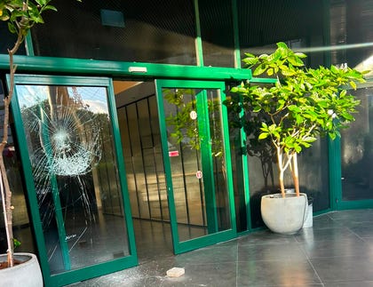 A door at the entrance to Channel 12 News' Tel Aviv offices after it was shattered Tuesday. A door at the entrance to Channel 12 News' Tel Aviv offices after it was shattered Tuesday.