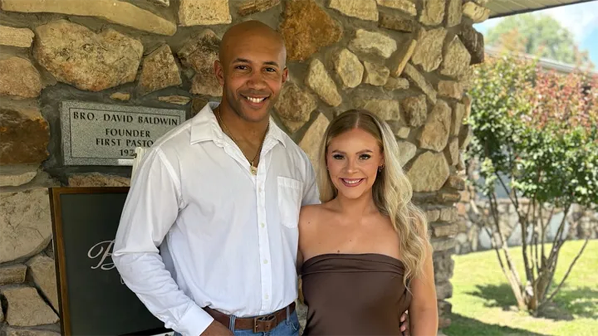 Fred Marsh posing with his fiancée, Hailey
