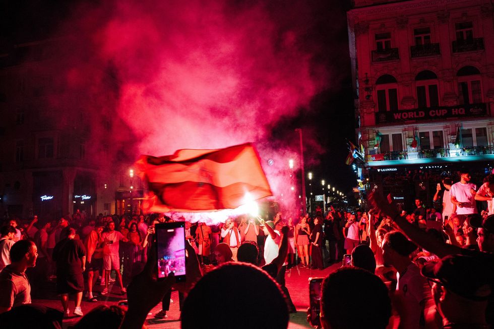 Crowds light flares and fly Palestinian flags in Brussels