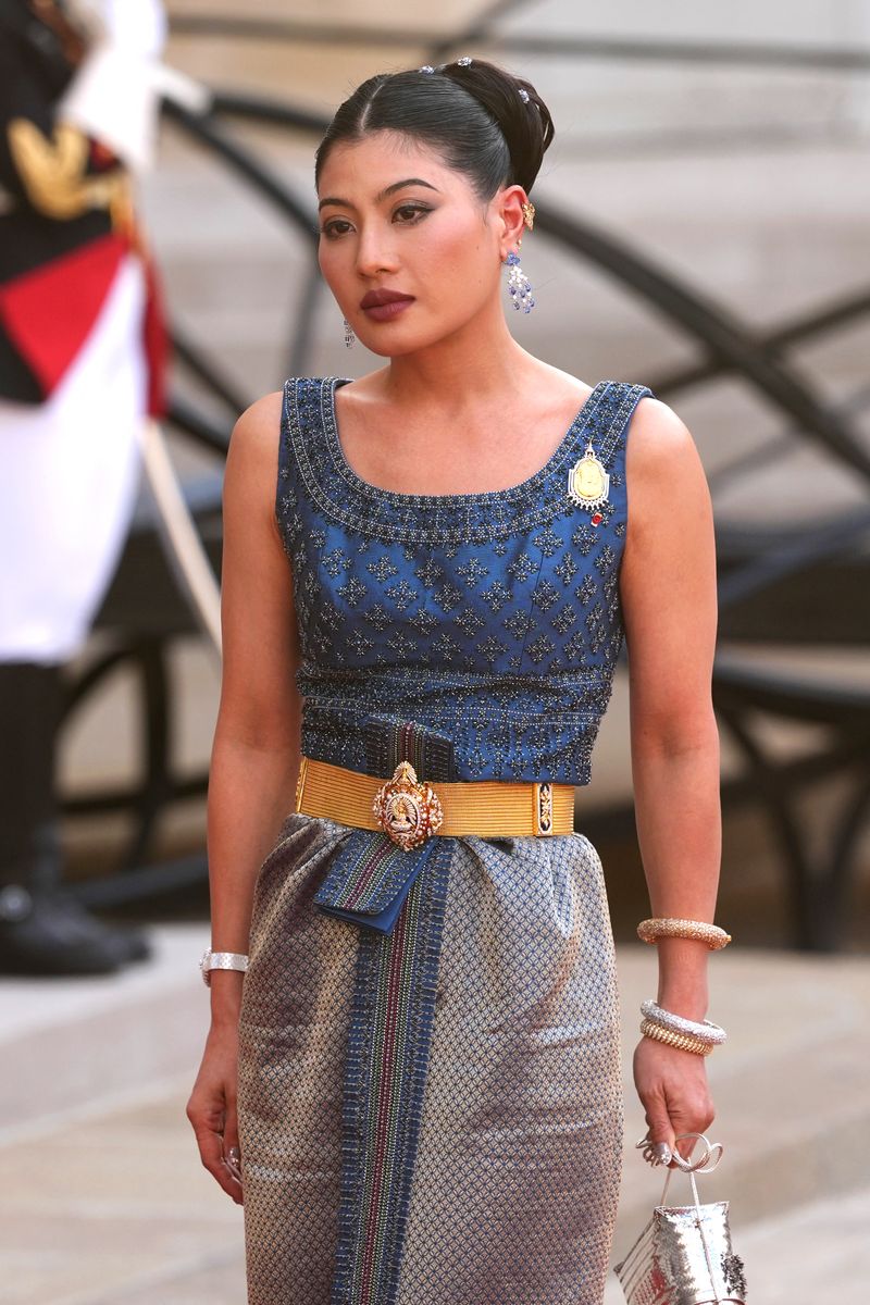 Princess Sirivannavari smiles as she arrives at the Élysée Palace for the official state banquet honoring Thailand's royal family in Paris.