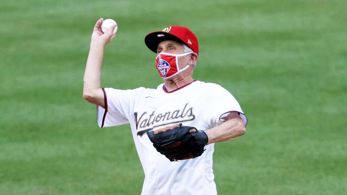 Dr. Anthony Fauci throws a ceremonial first pitch at Nationals Park.