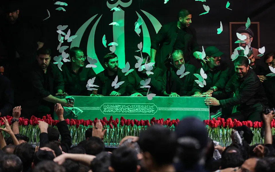 The coffin of Ali Khamenei is surrounded by people as the ceremonies, scheduled to last until July 9 across Iran, begin in Tehran