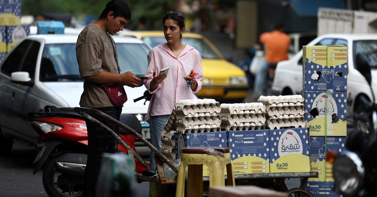 Iran faces region’s harshest mix of wartime contraction and inflation