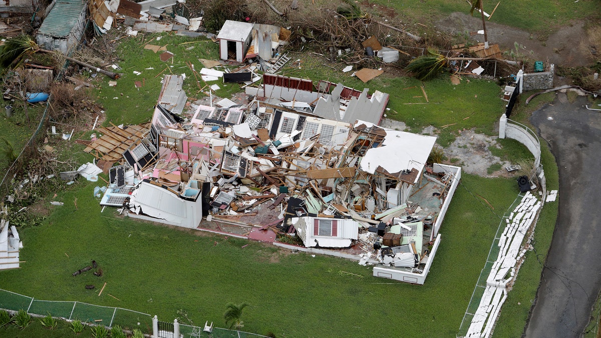 A destroyed home is seen from a Marine Corps MV-22 Osprey surveying damage from Hurricane Maria in St. Croix, , U.S. Virgin Islands, September 21, 2017. REUTERS/Jonathan Drake TPX IMAGES OF THE DAY - RC1AA78A7300