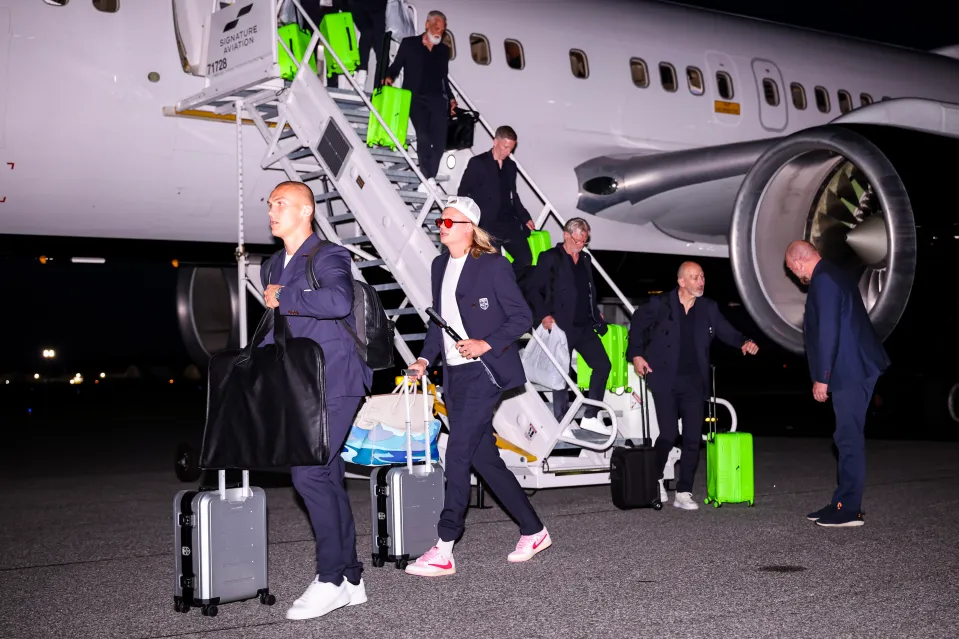Norway players walk off a plane after arriving in North Carolina