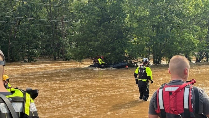 Swiftwater rescue teams stage in Lesterville, Missouri, amid Flash Flood Emergency