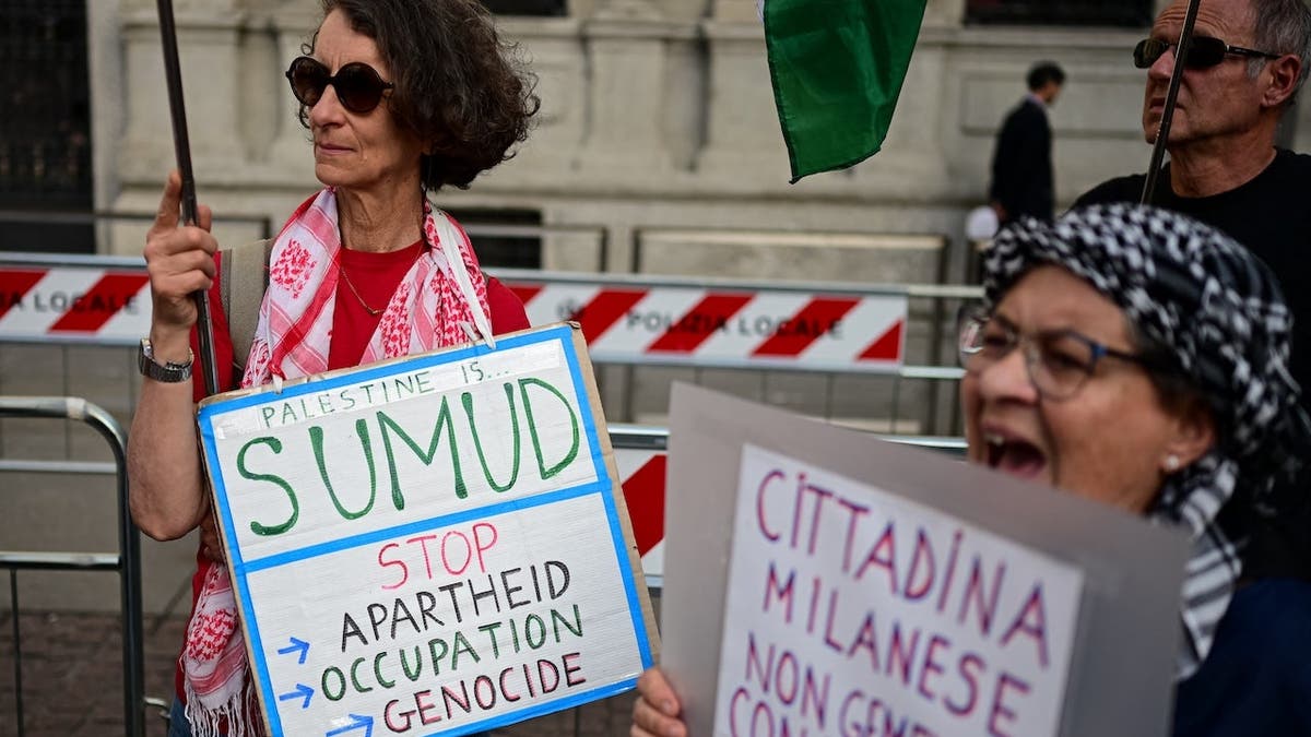 People participate in a flash mob protest in Milan against detention of Global Sumud Flotilla activists.