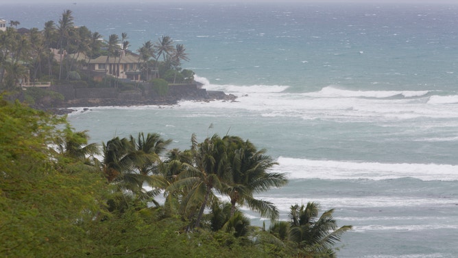 HONOLULU, HI - AUGUST 24: A large home on the coast is hit by waves from Hurricane Lane on August 24, 2018 in Honolulu, Hawaii.