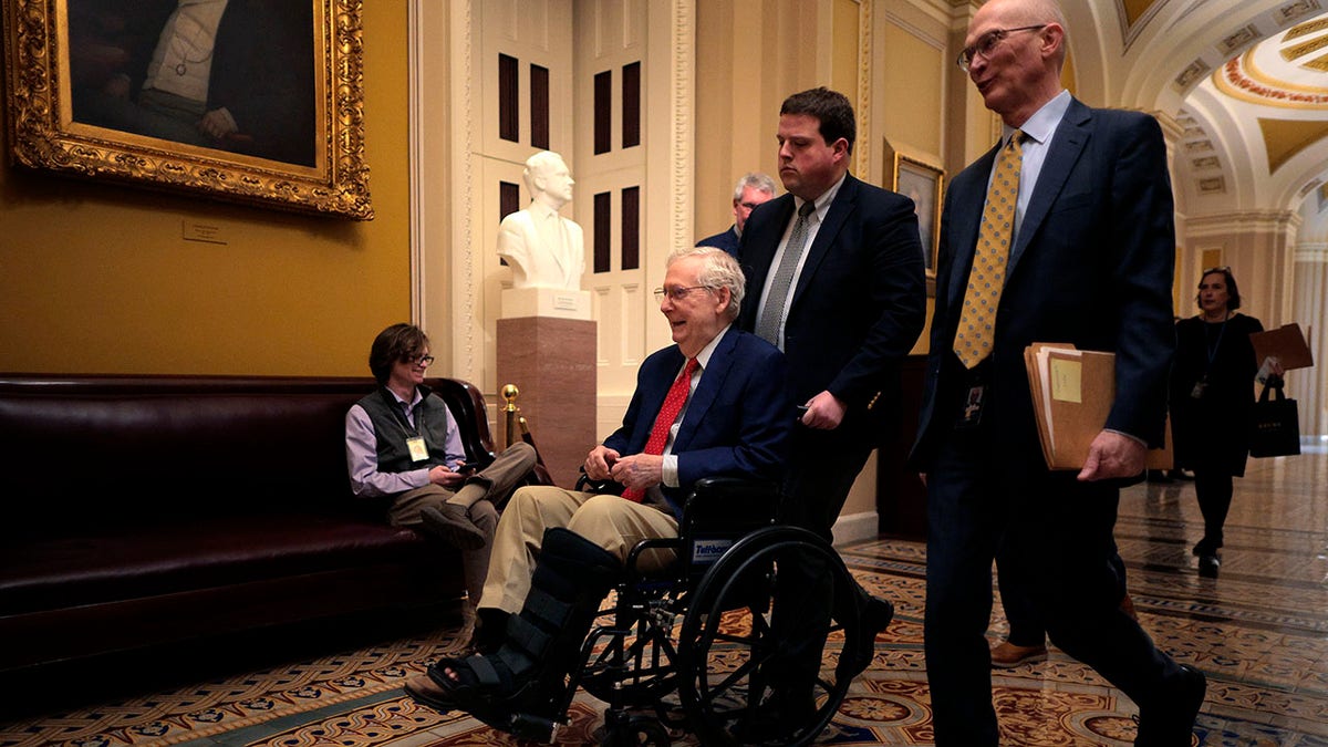 WASHINGTON, DC - FEBRUARY 20: Sen. Mitch McConnell (R-KY) is pushed in a wheelchair at the U.S. Capitol on February 20, 2025 in Washington, DC. McConnell, 83, the seven-term Senator from Kentucky who served 18 years as the Republican leader, announced he will not seek reelection and will retire after his current term.
