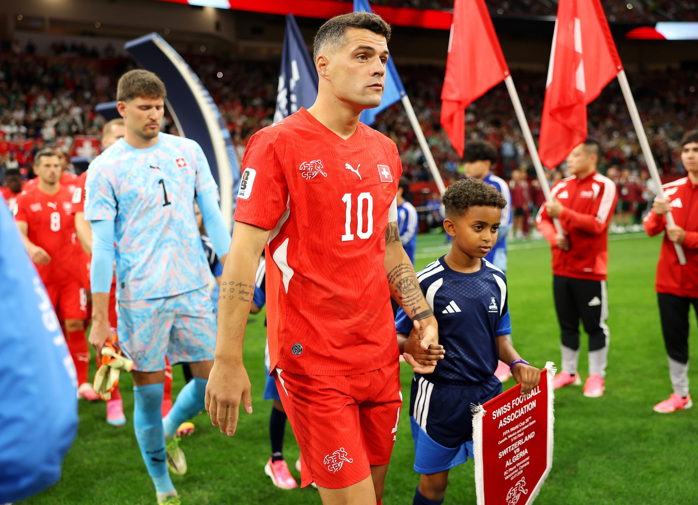 VANCOUVER, BRITISH COLUMBIA - JULY 02: Granit Xhaka #10 of Switzerland leads teammates onto the pitch before the FIFA World Cup 2026 Round of 32 match between Switzerland and Algeria at BC Place Vancouver on July 02, 2026 in Vancouver, British Columbia. (Photo by Sarah Stier - FIFA/FIFA via Getty Images)