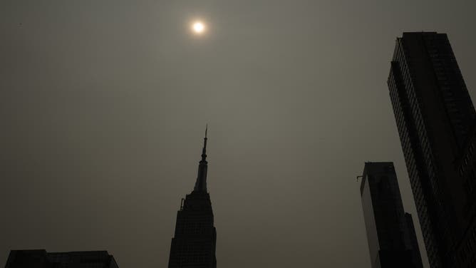 NEW YORK, NEW YORK - JULY 16: Haze from Canadian wildfires blankets the Manhattan buildings, including the Empire State Building, on July 16, 2026 in New York City. Much of the East Coast and Canada is under an Air Quality Health Advisory as the Canadian and Great Lakes wildfire smoke gradually moves through the area, creating a thick haze in the heat. The region is experiencing temperatures with heat indexes over 100 degrees as it confronts another heat wave.