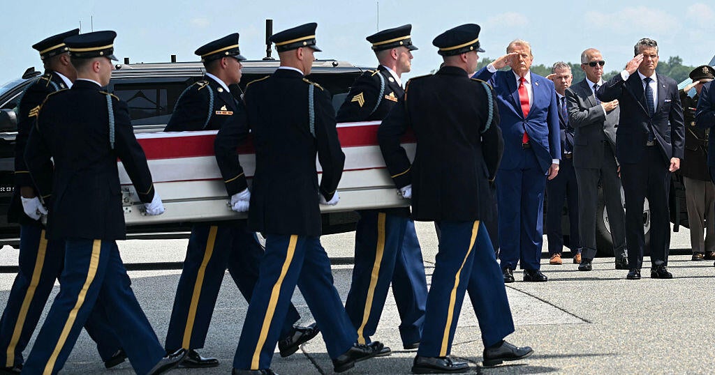 President Trump and Defense Secretary Pete Hegseth salute during a dignified transfer for Sgt. Angel S. Rampersad at Dover Air Force Base in Dover, Delaware, on July 22, 2026.