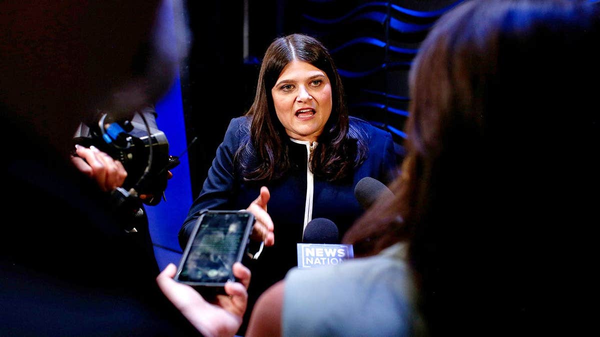 Rep. Haley Stevens gestures while speaking with reporters