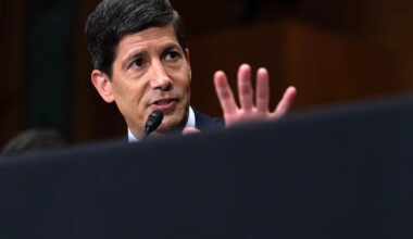 Fed holds interest rates steady, but 3 officials dissent in favor of a hike