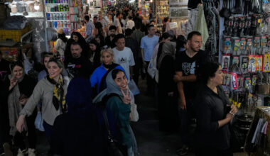 US strikes bridges and collapses a tower at a key port as its Iran campaign expands