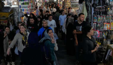 US strikes bridges and collapses a tower at a key port as its Iran campaign expands