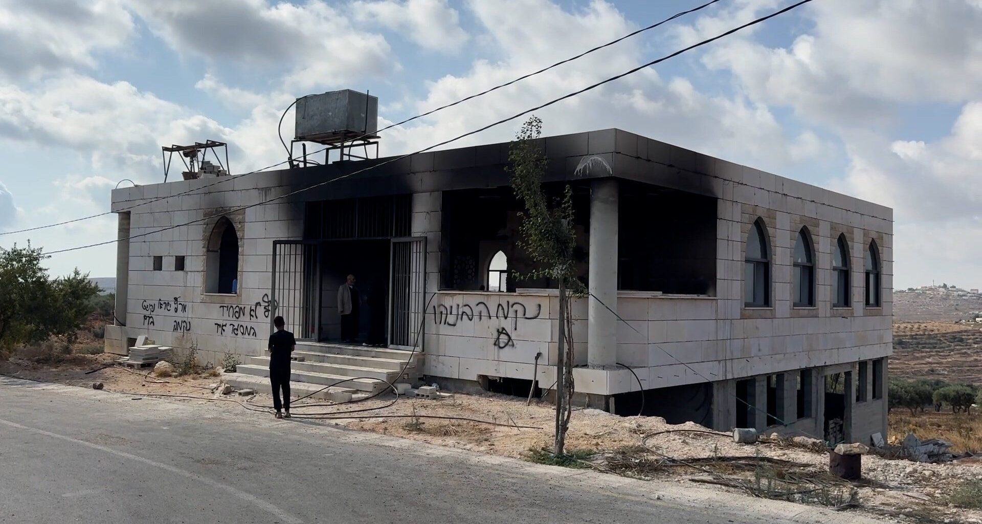 Israeli settlers burn two mosques in occupied West Bank | Occupied West Bank