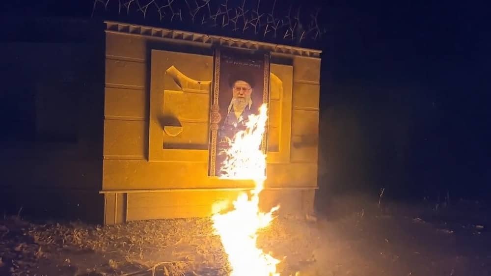 Rask, Iran – July 7, 2026: Resistance units set fire to a large mural of Ali Khamenei