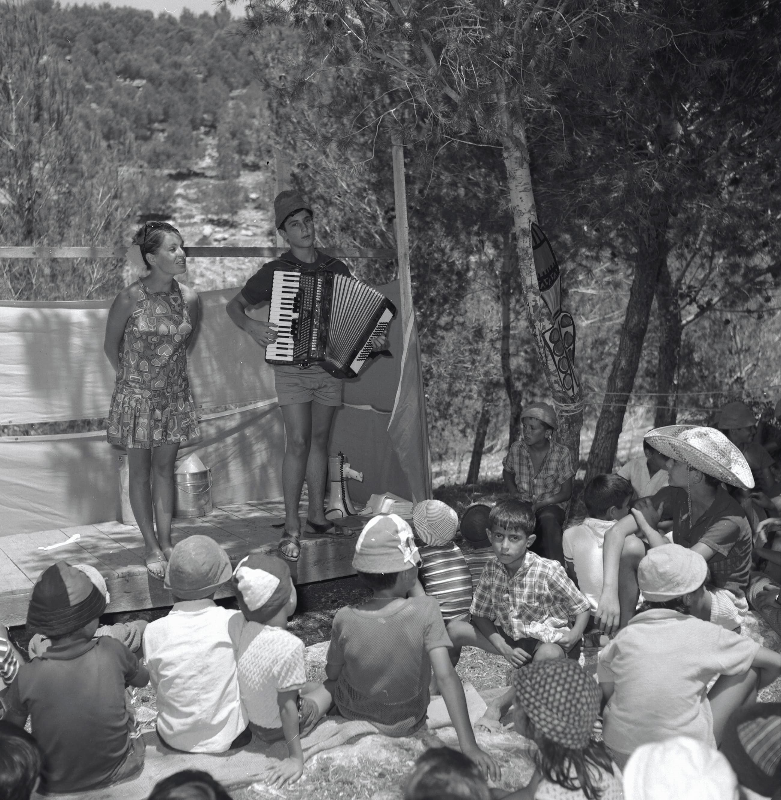 Children from the Beit She'an Valley participate in a community sing-along at Ben Shemen summer camp, 1969. Photo by Dafnai Ish Shalom, KKL-JNF Photo Archive.