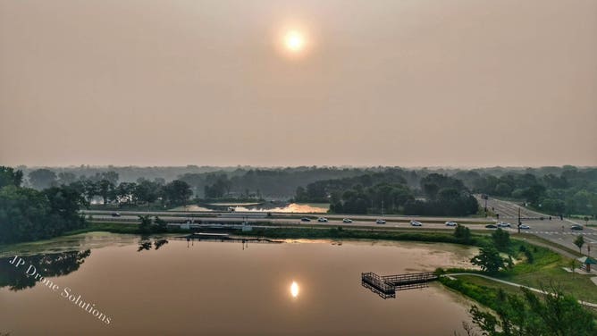 Hazy sunrise over Champlin, Minnesota on July 16.