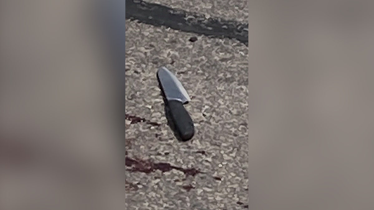 knife on floor near blood