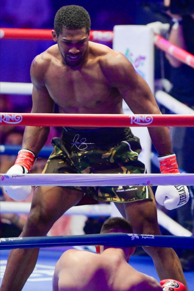 Anthony Joshua stands over Kristian Prenga seconds after knocking him out