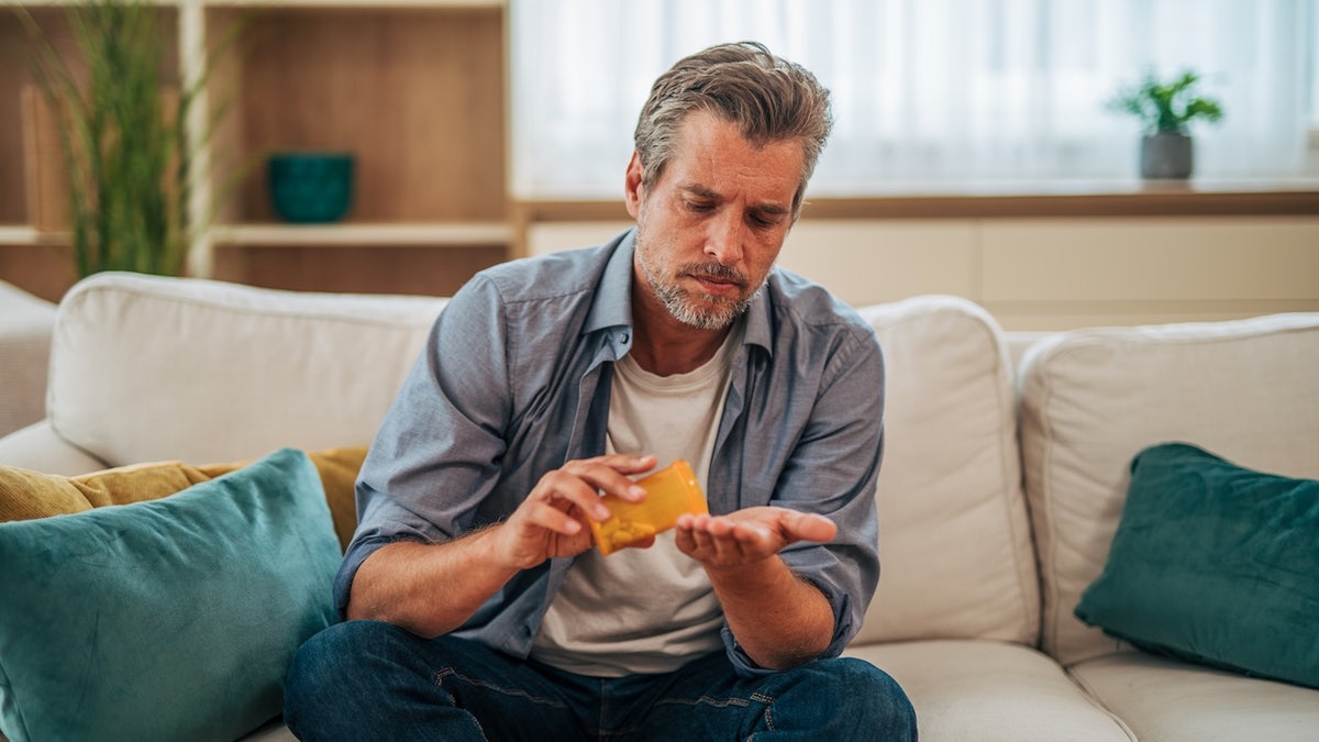 Man taking pill
