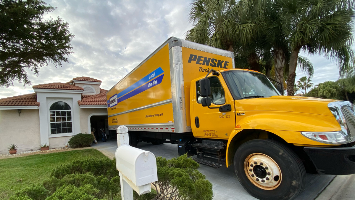 Penske moving truck parked in driveway of home, Palm Beach Gardens, Florida.