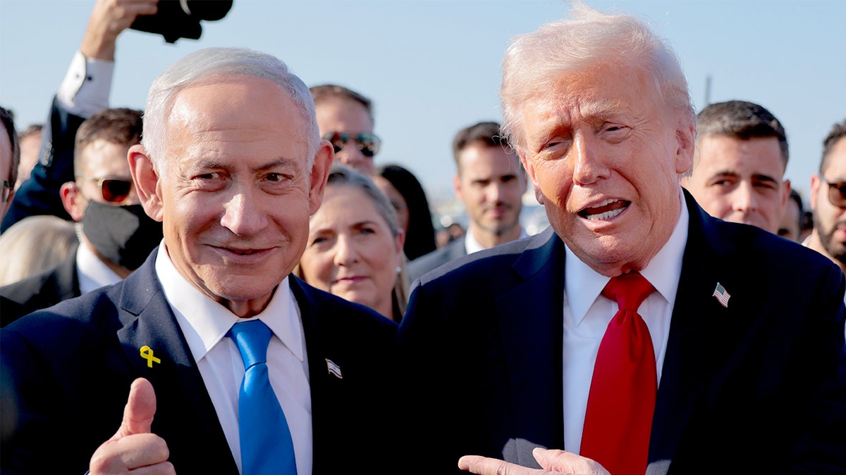 U.S. President Donald Trump speaking to Israeli Prime Minister Benjamin Netanyahu at Ben Gurion International Airport
