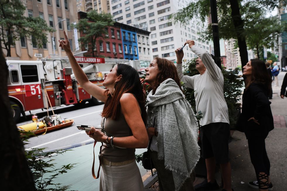 New Yorkers look at the tilting building