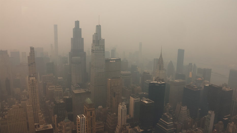 NEW YORK, NY - JULY 16: Smoke from wildfires in Canada shrouds midtown Manhattan, seen from the 86th-floor observation deck of the Empire State Building on July 16, 2026, in New York City. (Photo by Gary Hershorn/Getty Images) 