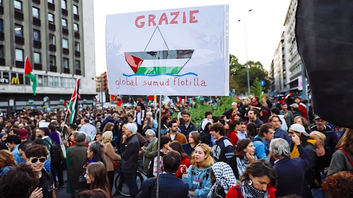 Demonstrators gather during a protest supporting the Global Sumud Flotilla in Milan.