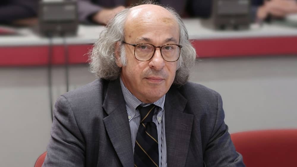Iranian artist and sculptor Reza Olia, a longtime member of the National Council of Resistance of Iran, at an NCRI meeting