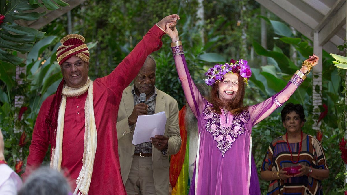 Neville Roy Singham and Jodie Evans at wedding officiated by Danny Glover