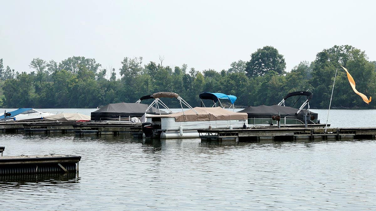 Boats sit moored on the Scioto River in Powell, Ohio.