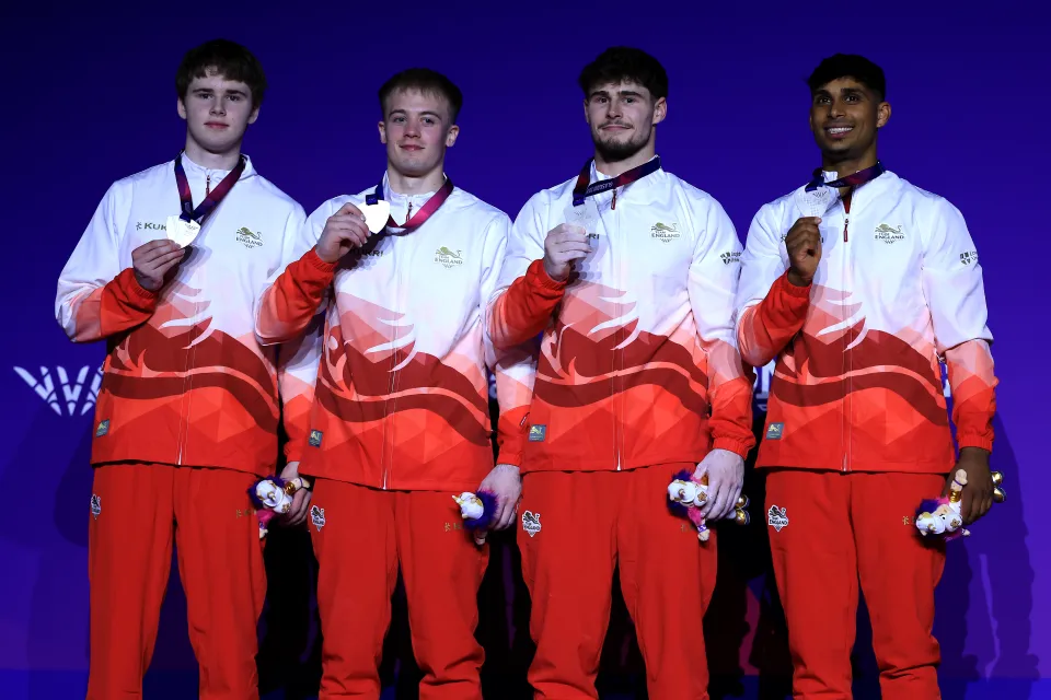 Team England celebrate silver in the gymnastics team event at the Commonwealth Games