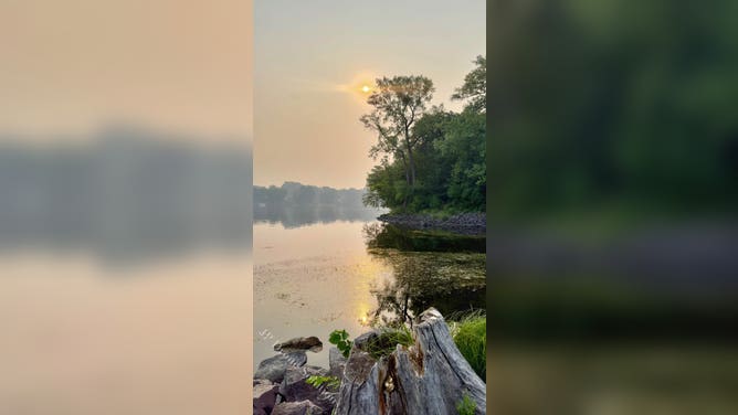 Orange smoky skies at sunrise in Champlin, Minnesota.