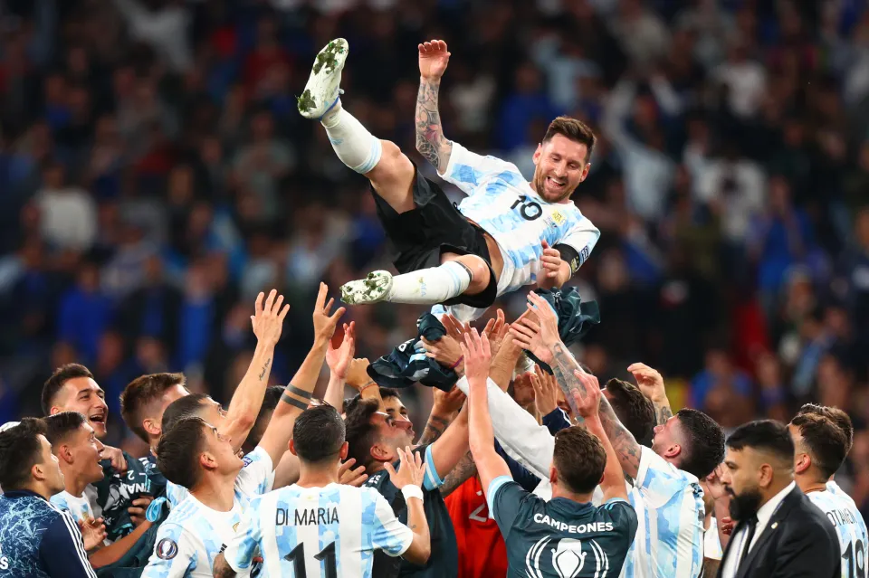 Lionel Messi is thrown in the air by his teammates as Argentina celebrate winning the Finalissima against Italy at Wembley, June 2022