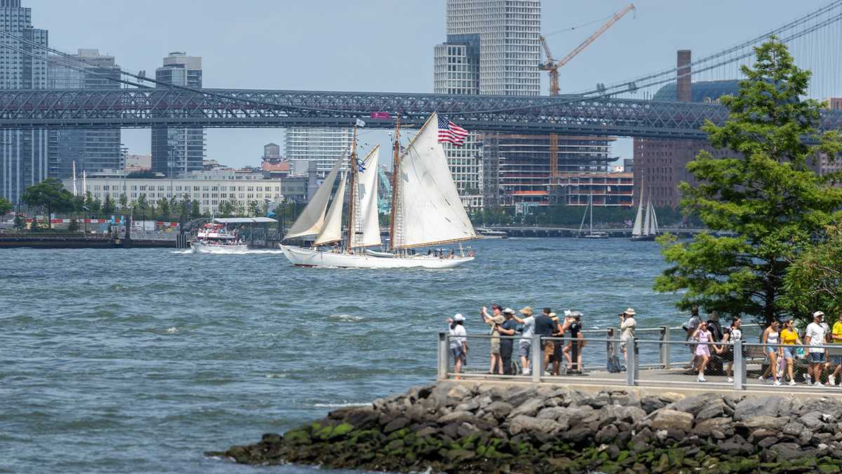 The tall ship Bowdoin sails along the East River during a preliminary parade on July 3, 2026, in New York City.