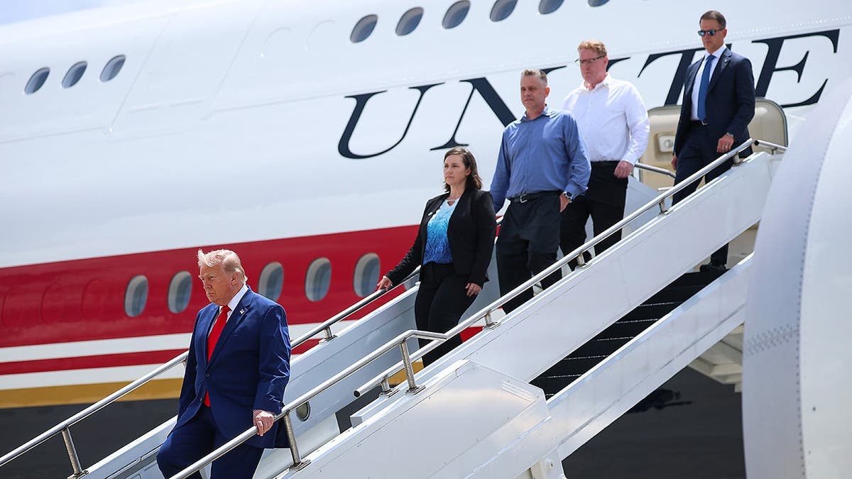 Army 1st Lt. Tyler James Feehan's family departs Air Force One with President Trump.