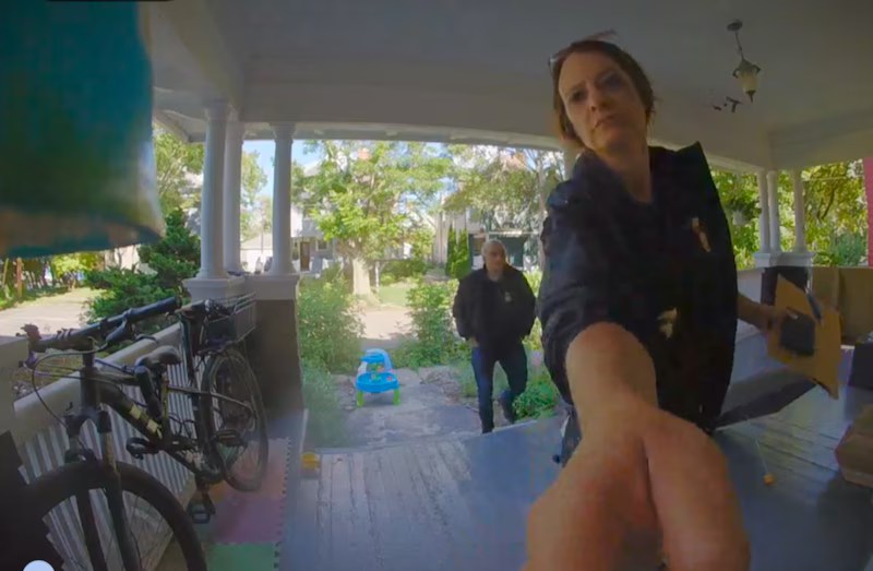 ICE agents at David Streever’s door. Image courtesy of FIRE.