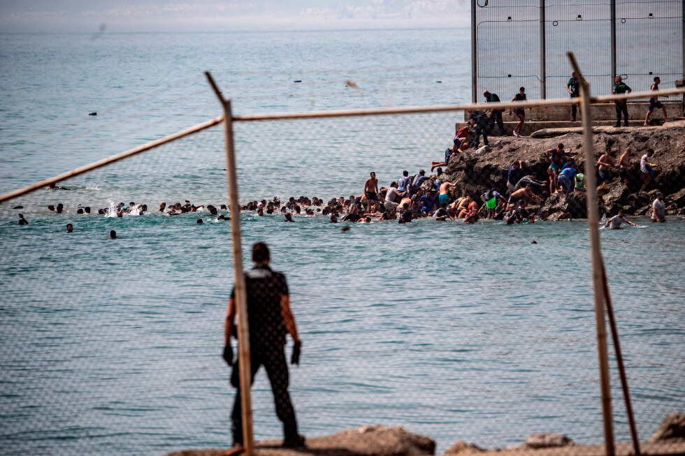 Thousands break through border separating Spain's Ceuta from Morocco
