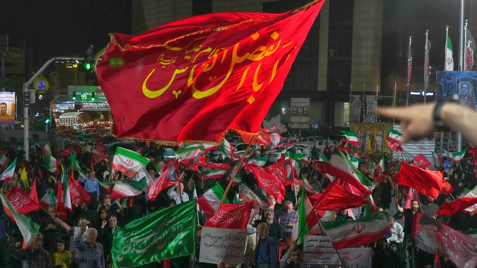 Iran says it is suspending commitments to interim deal with US as the two exchange attacks