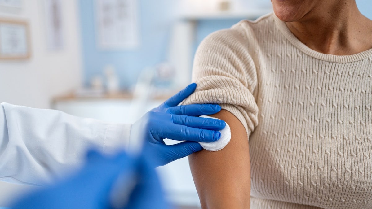 Woman getting prepped for vaccine