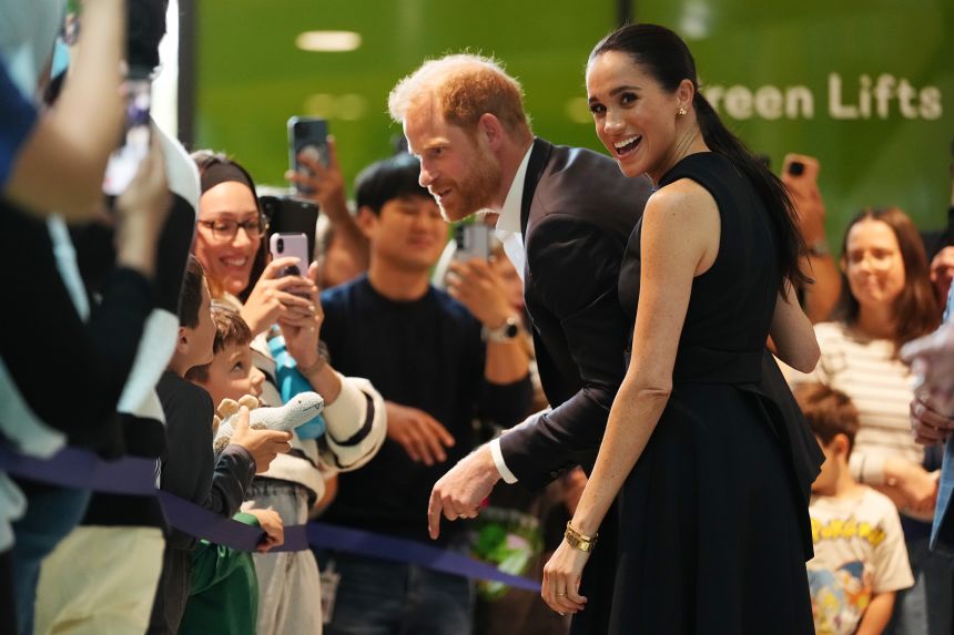 Britain's Prince Harry and his wife Meghan, Duchess of Sussex, meet children and their families during a visit to a hospital in Melbourne in April 2026. They were on a four-day visit to Australia, with engagements across Melbourne, Canberra and Sydney.