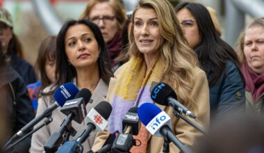 Ingrid Falaise speaks at a press conference calling on measures to prevent femicides, as others including Québec solidaire co-spokesperson Ruba Ghazal listen.