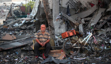A Palestinian man rests amid debris at the site of an Israeli strike on a house in Gaza City, on July 30, 2026.