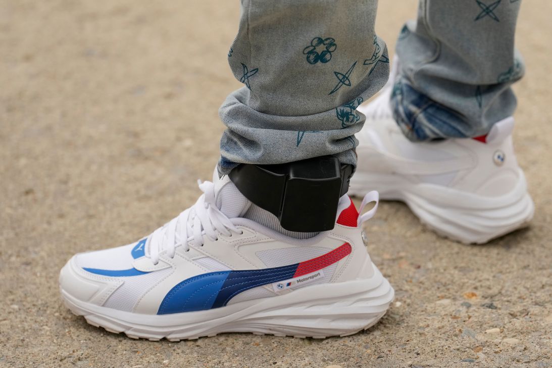 Philbert Viaud, a Haitian resident of Columbus, Ohio, departs an ICE Enforcement and Removal Operations field office with an ankle monitor after an appointment in Cincinnati on August 2.